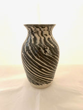Load image into Gallery viewer, After a day or two, you skim trim the entire outside of the vase to reveal the design created with the inlaid colored coils.  Once the vase is completely dry, the entire pot is scraped with a metal rib before the first firing.  After this firing, the entire surface is sanded before glazing.